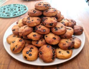 Chocolate chip cookies piled up on a plate